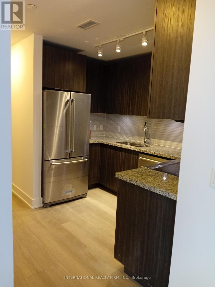 Brand New Fridge Still has Wrapping on It. - 816 - 30 Shore Breeze Drive, Toronto, ON - Indoor Photo Showing Kitchen