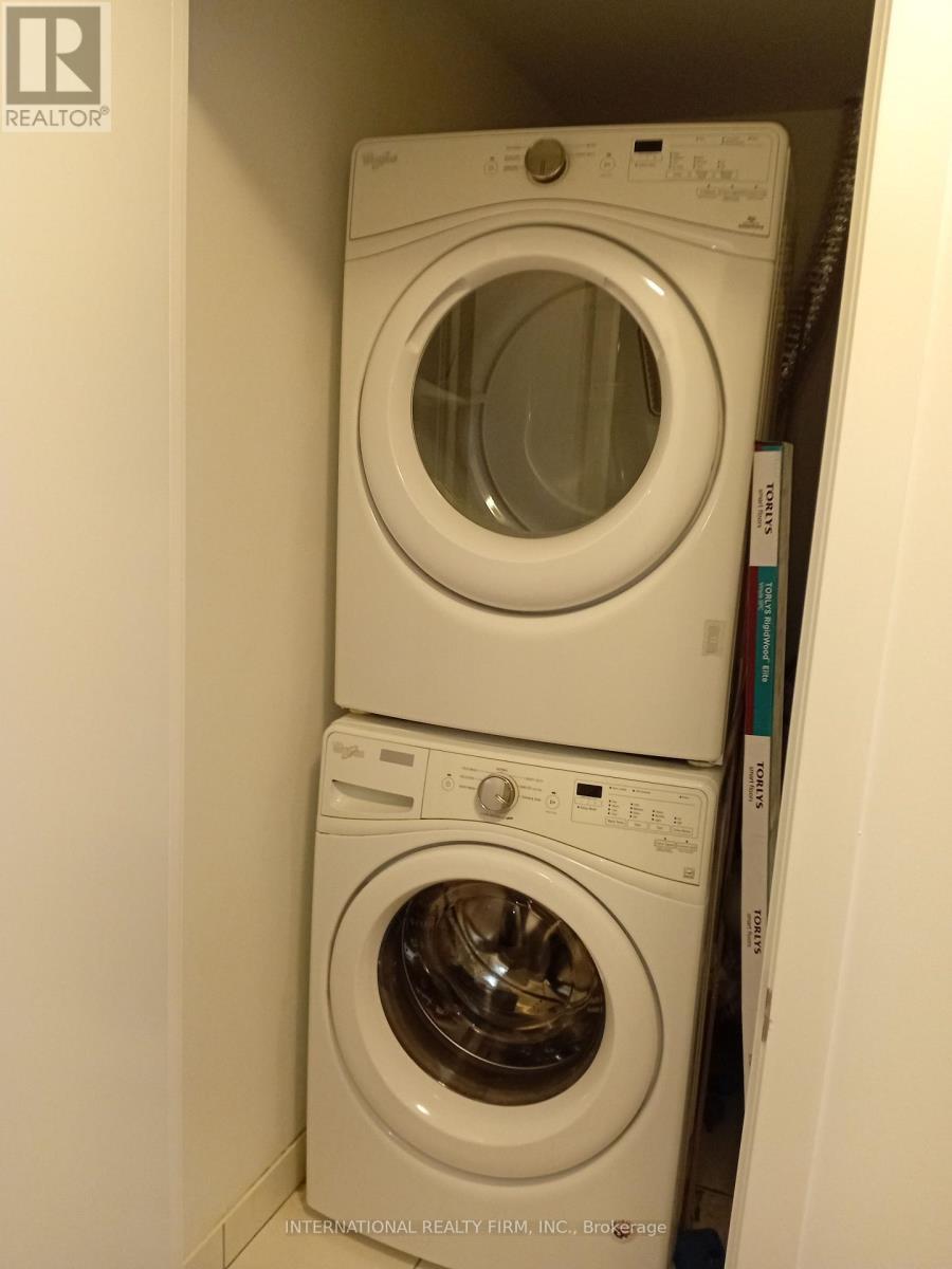 Stack Washer/Dryer - 816 - 30 Shore Breeze Drive, Toronto, ON - Indoor Photo Showing Laundry Room