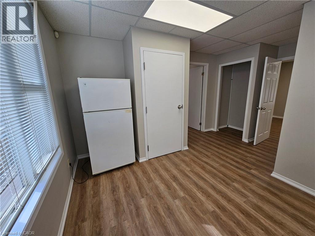 Kitchen with fridge on main floor - 100 E Lancaster Street E, Kitchener, ON