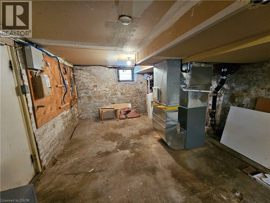 unfinished portion of basement has furnace, water heater and some potential room for rough storage - 100 E Lancaster Street E, Kitchener, ON