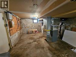 unfinished portion of basement has furnace, water heater and some potential room for rough storage -