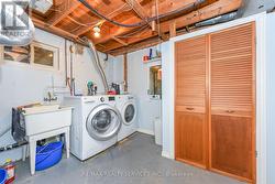 L-Shaped Laundry Rm in lower level & Storage Area -
