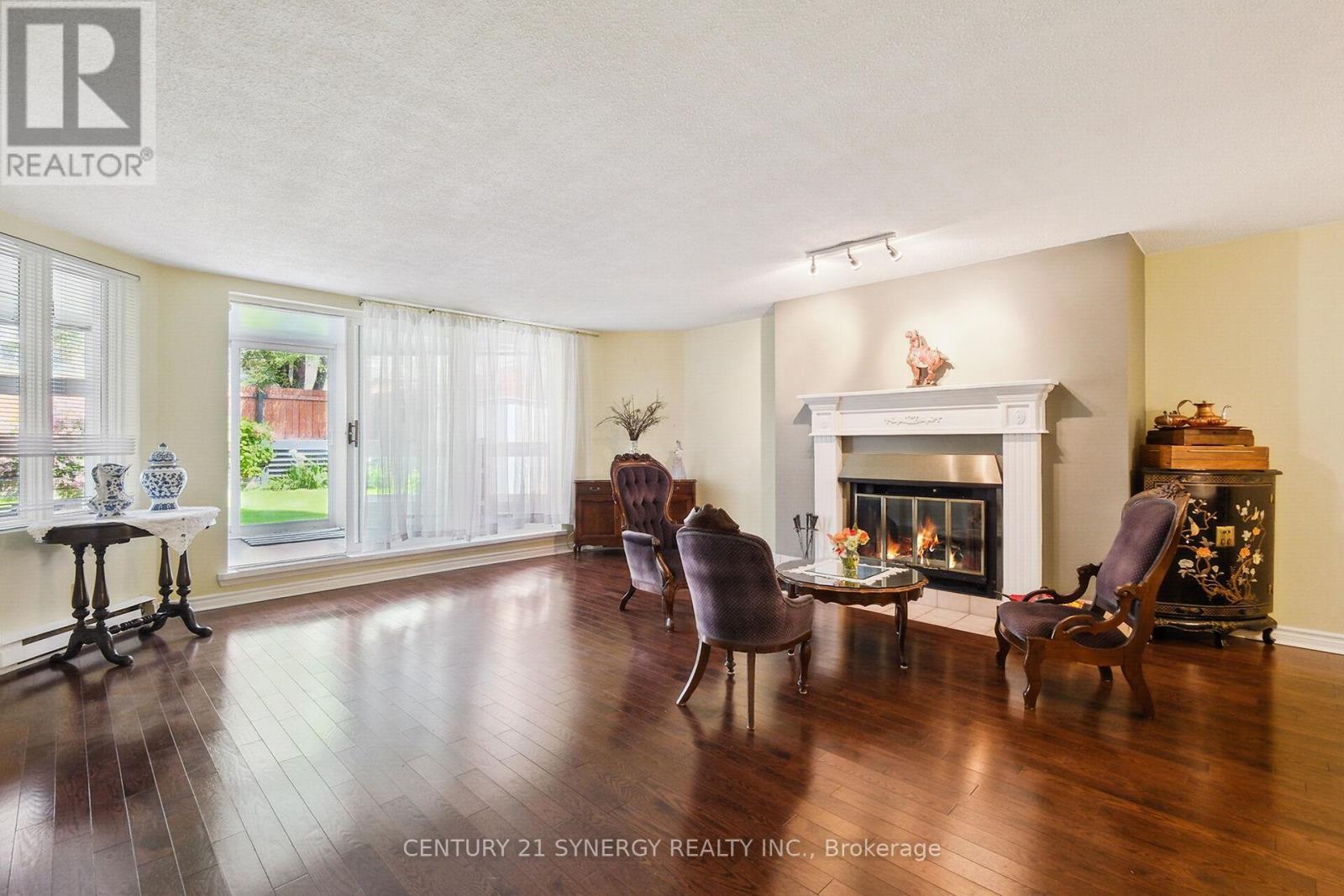 Hardwood floors in the main living area - 104 - 295 Gilmour Street, Ottawa, ON - Indoor Photo Showing Living Room With Fireplace