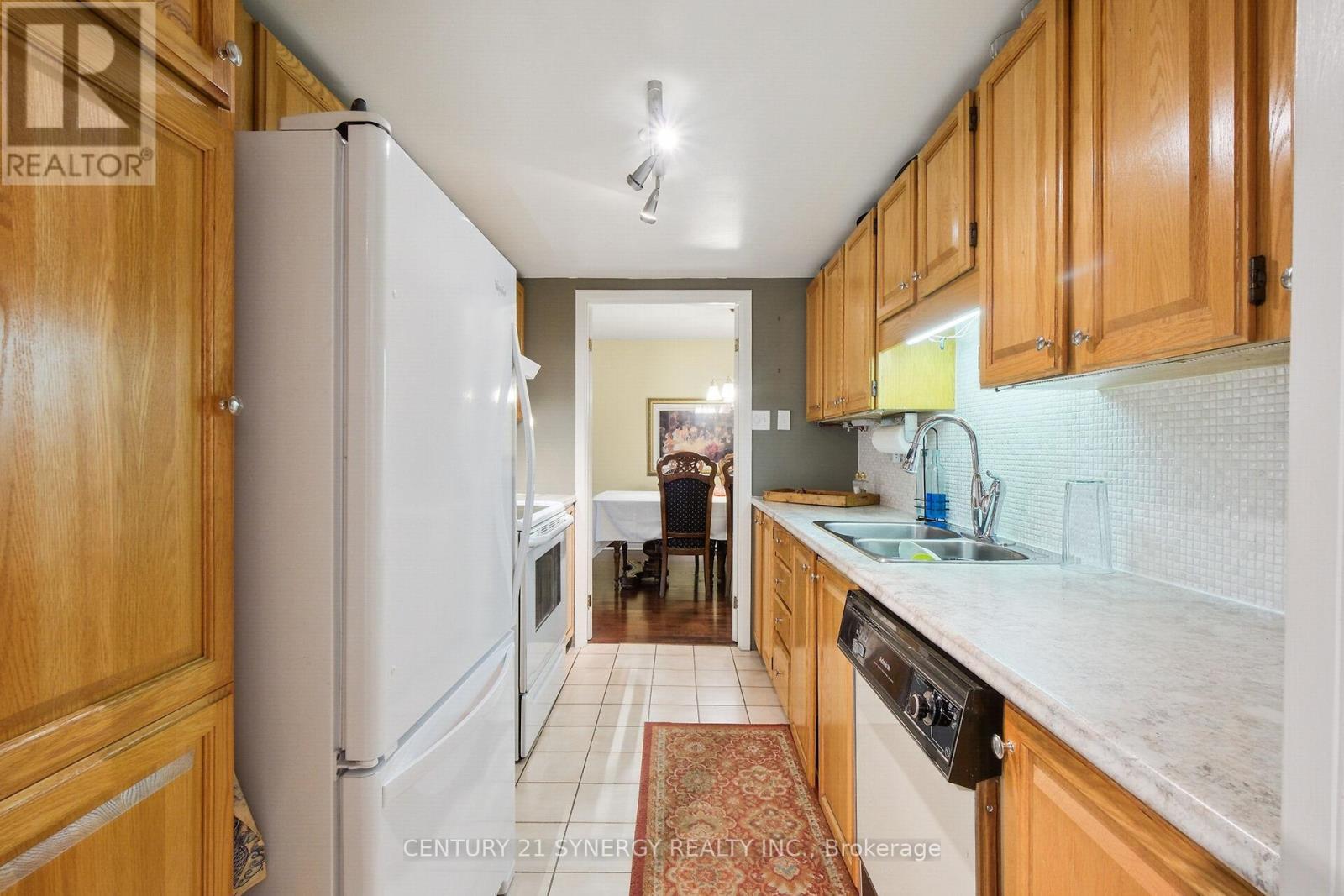 A huge Galley Kitchen - 104 - 295 Gilmour Street, Ottawa, ON - Indoor Photo Showing Kitchen With Double Sink