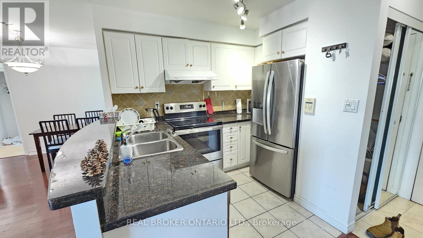 1516 - 7 Lorraine Drive, Toronto, ON - Indoor Photo Showing Kitchen With Stainless Steel Kitchen With Double Sink