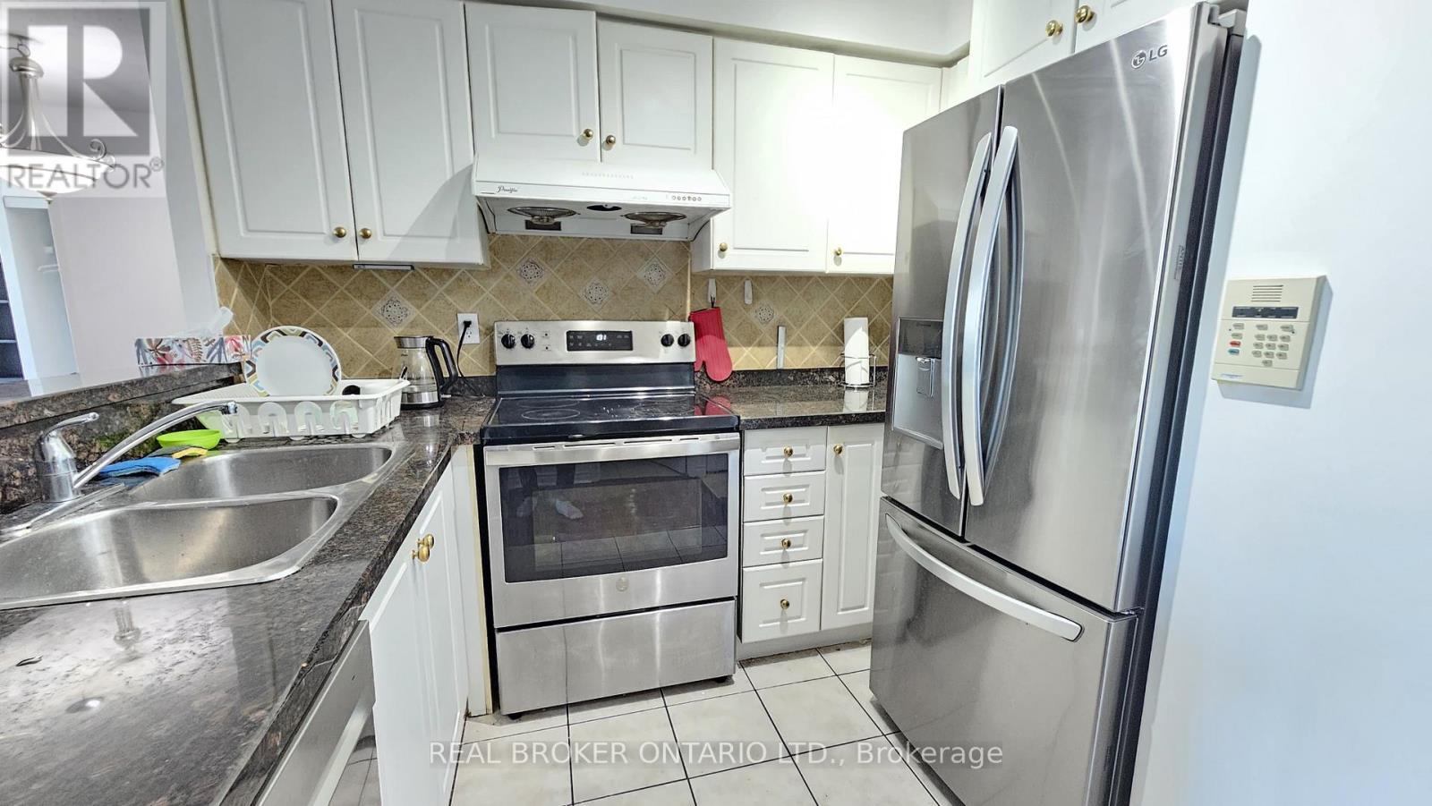 1516 - 7 Lorraine Drive, Toronto, ON - Indoor Photo Showing Kitchen With Stainless Steel Kitchen With Double Sink