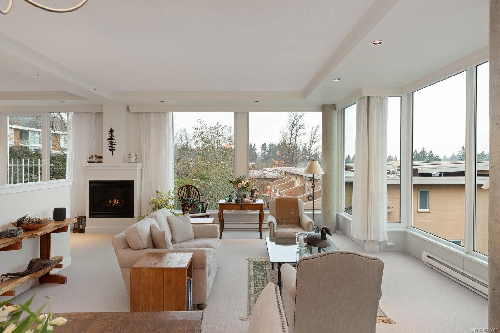 304-5350 Sayward Hill Cres, Saanich, BC - Indoor Photo Showing Other Room With Fireplace