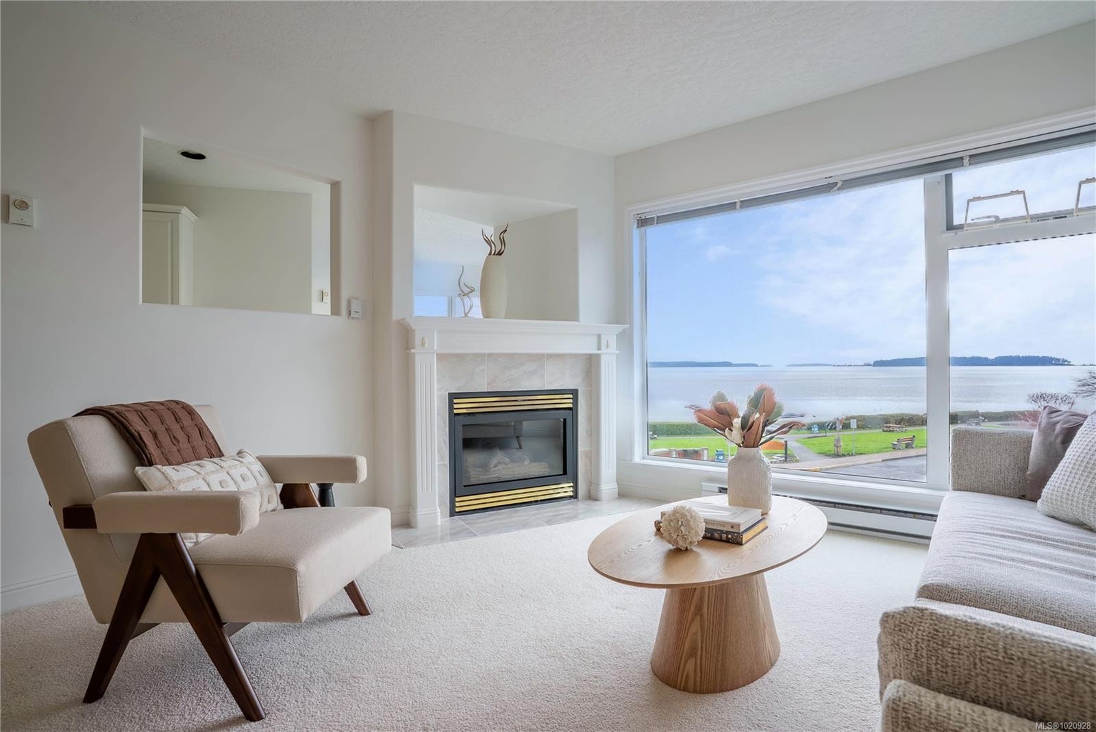 308-2550 Bevan Ave, Sidney, BC - Indoor Photo Showing Living Room With Fireplace