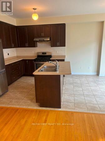 Ceramic Floor for easy cleaning - 12 Haviland Circle, Brampton, ON - Indoor Photo Showing Kitchen With Double Sink
