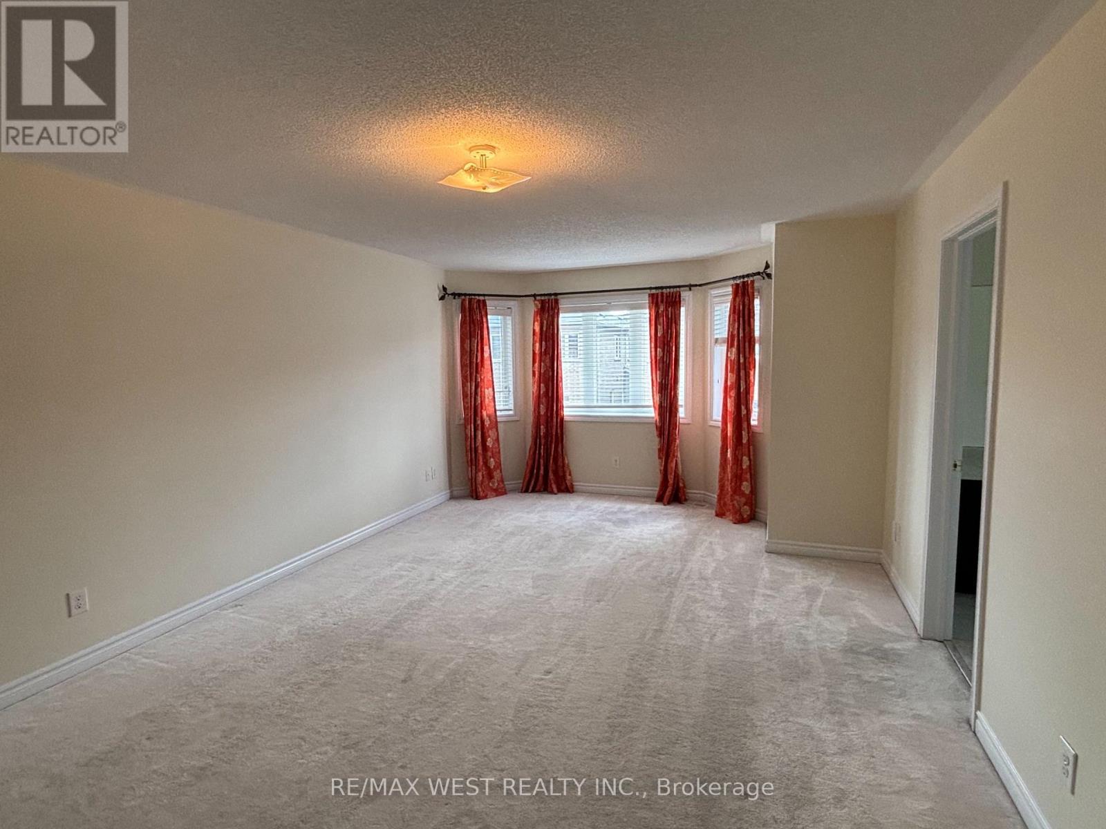 Wall of windows for Daily Dose of Sunshine - 12 Haviland Circle, Brampton, ON - Indoor Photo Showing Other Room