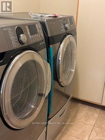 Front Load Washer & Dryer (Shared) - 12 Haviland Circle, Brampton, ON - Indoor Photo Showing Laundry Room