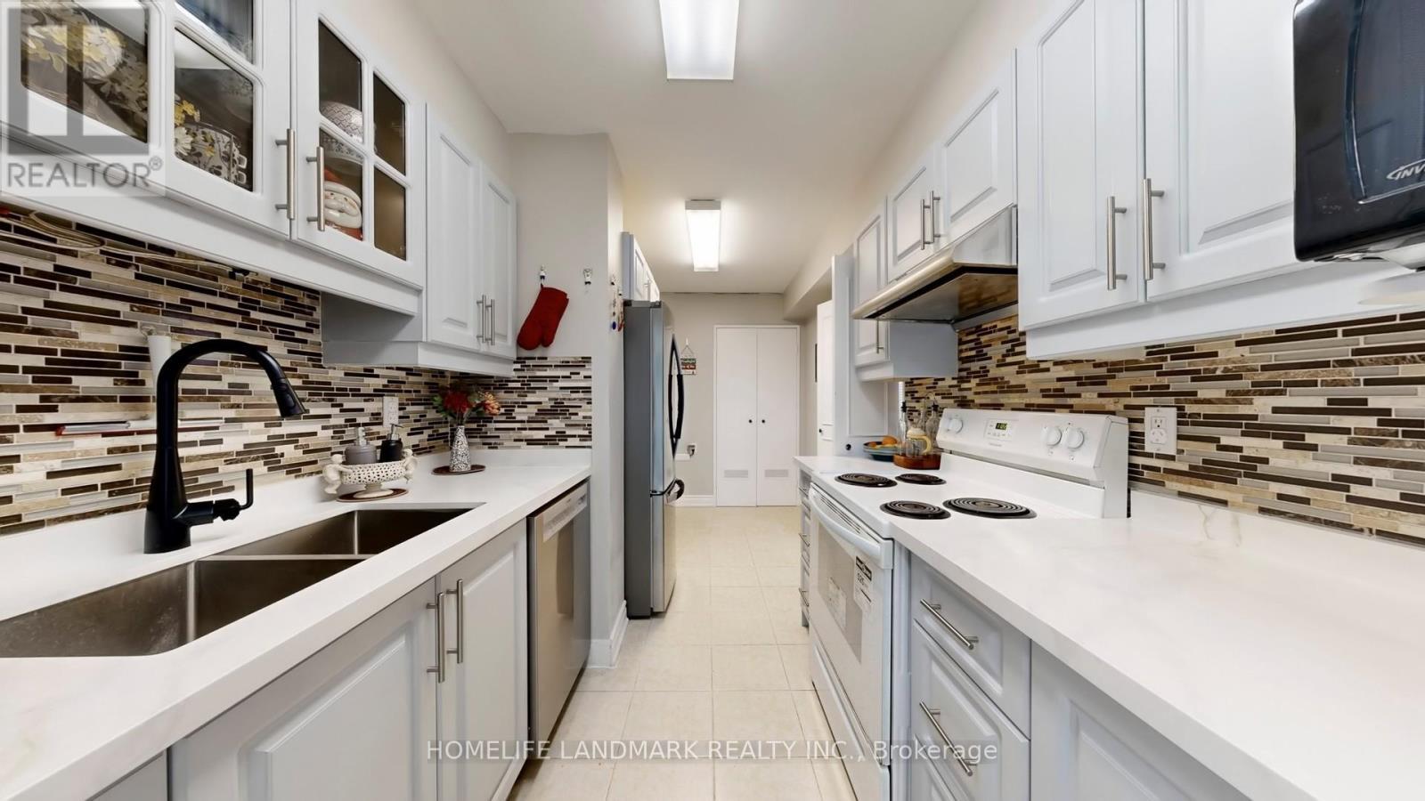 1001 - 25 Silver Springs Boulevard, Toronto, ON - Indoor Photo Showing Kitchen With Double Sink