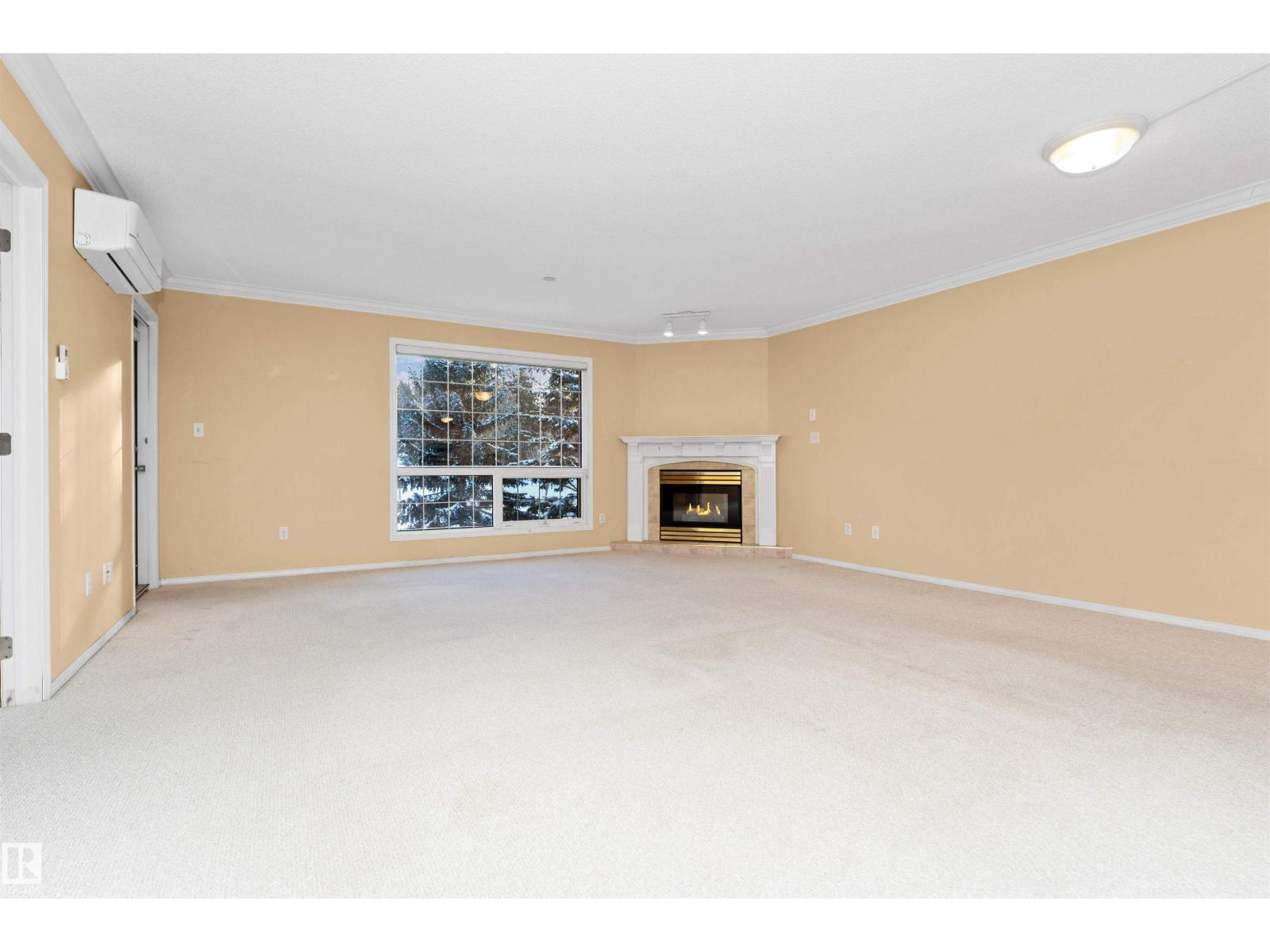 #304 20 St Joseph St, St. Albert, AB - Indoor With Fireplace