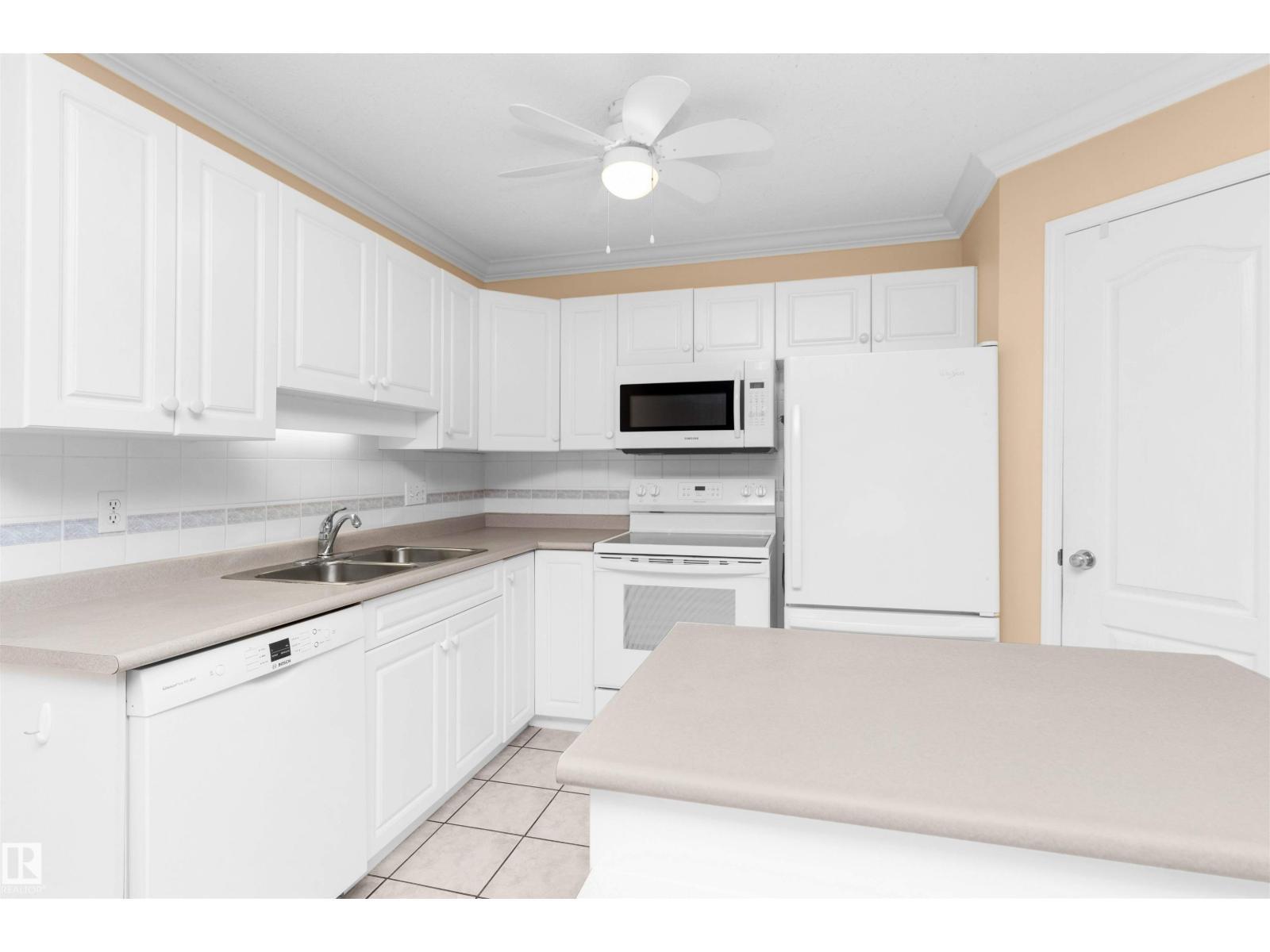 #304 20 St Joseph St, St. Albert, AB - Indoor Photo Showing Kitchen With Double Sink