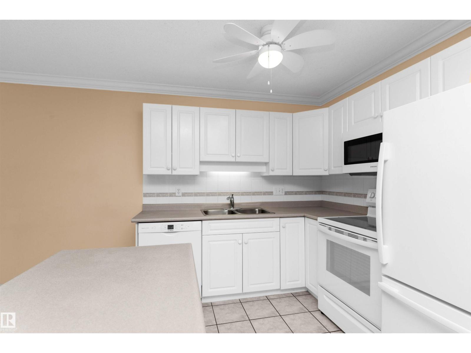 #304 20 St Joseph St, St. Albert, AB - Indoor Photo Showing Kitchen With Double Sink