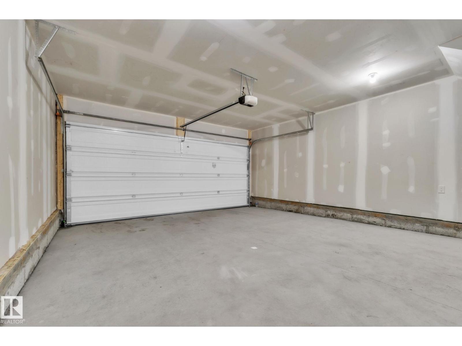 #15 6905 25 Av Sw, Edmonton, AB - Indoor Photo Showing Garage