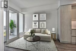 Virtually Staged-Living Room Opens onto a Balcony -