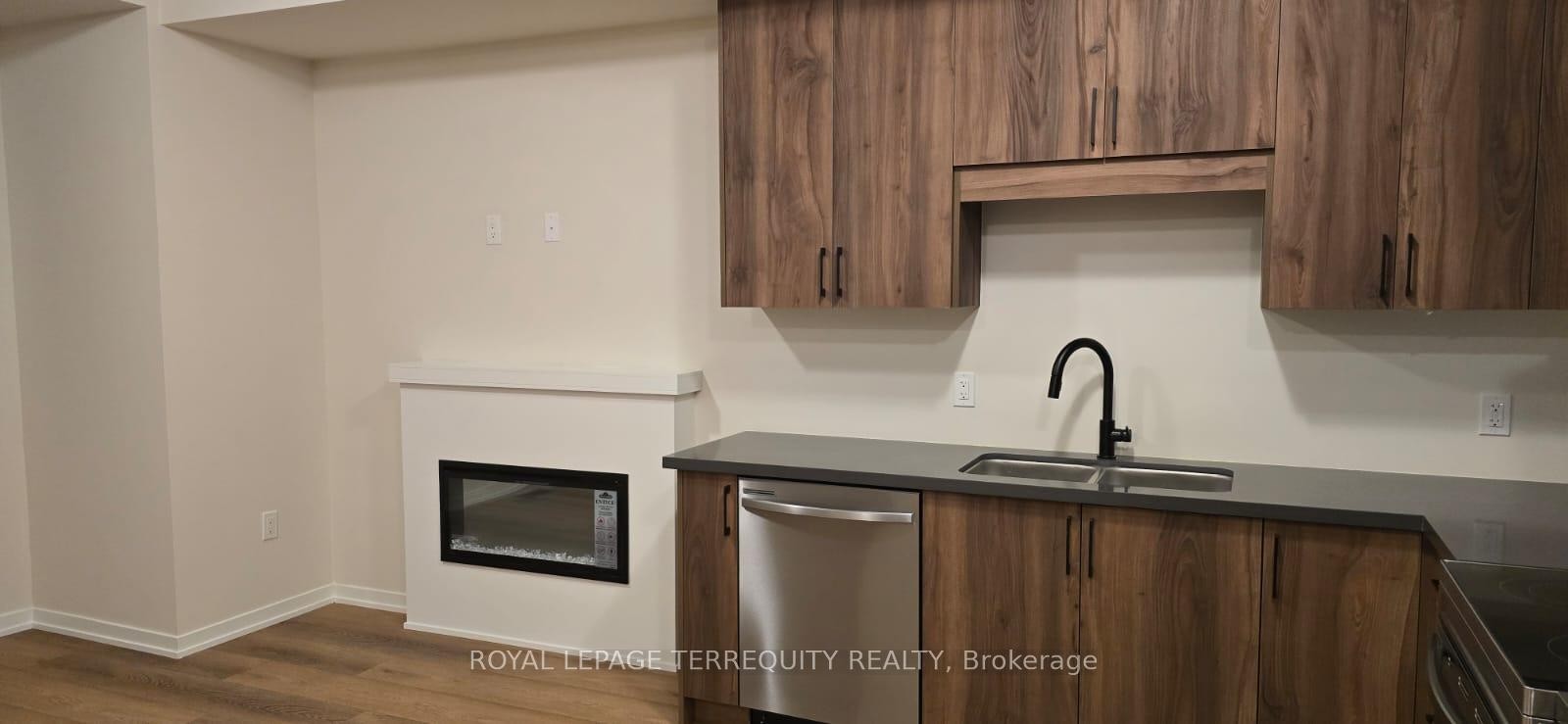 38 Kingbird Common, Cambridge, ON - Indoor Photo Showing Kitchen With Fireplace