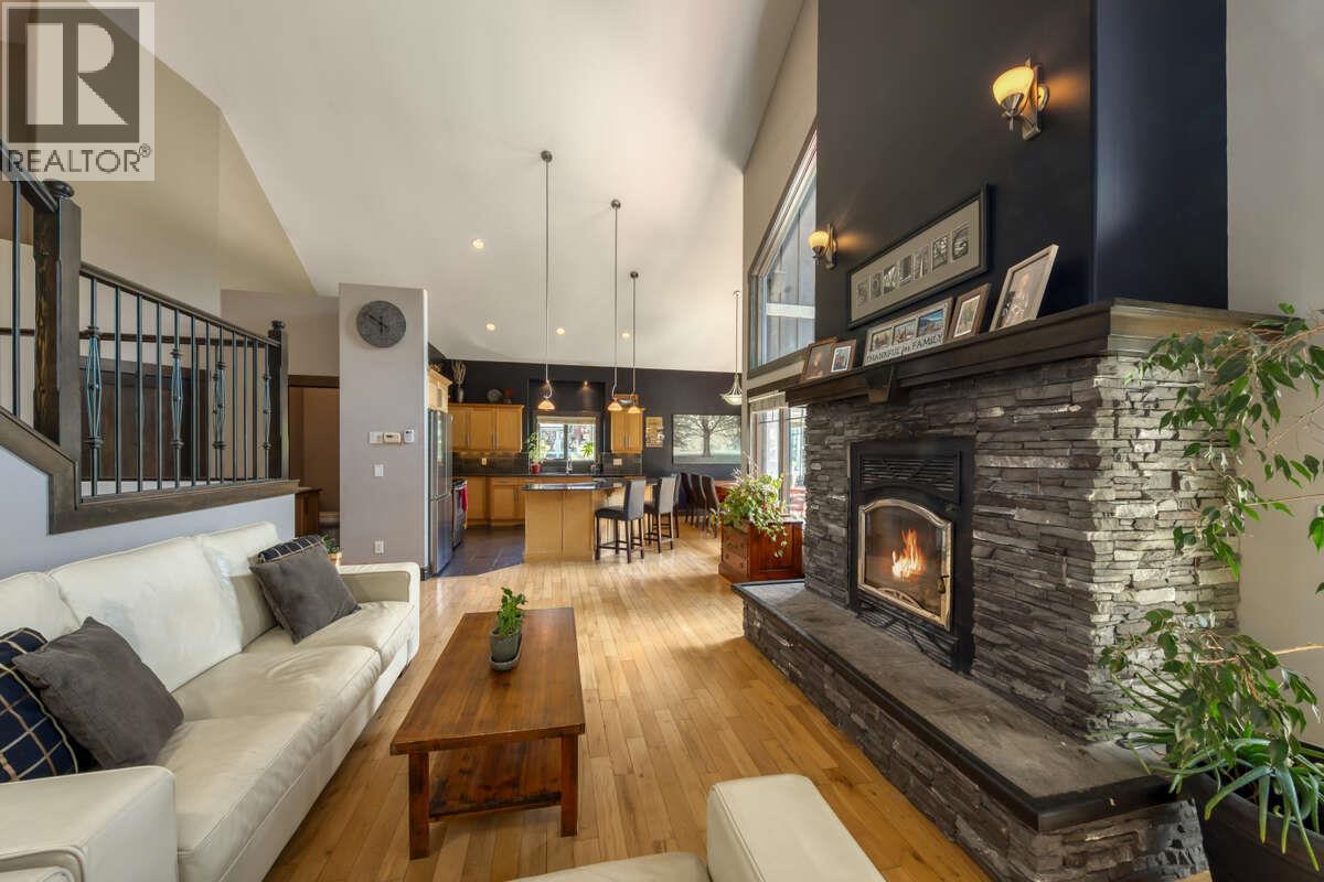 2576 Sandstone Green, Invermere, BC - Indoor Photo Showing Living Room With Fireplace