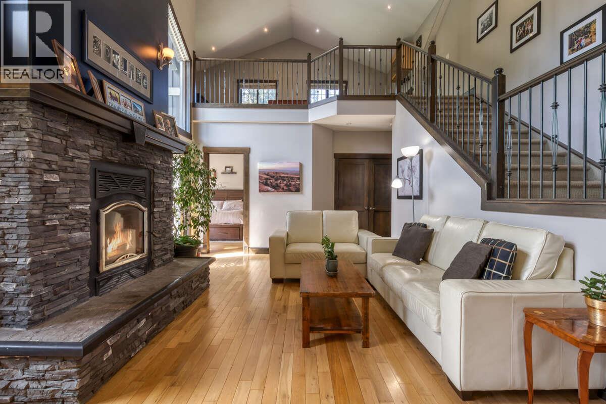 2576 Sandstone Green, Invermere, BC - Indoor Photo Showing Living Room With Fireplace
