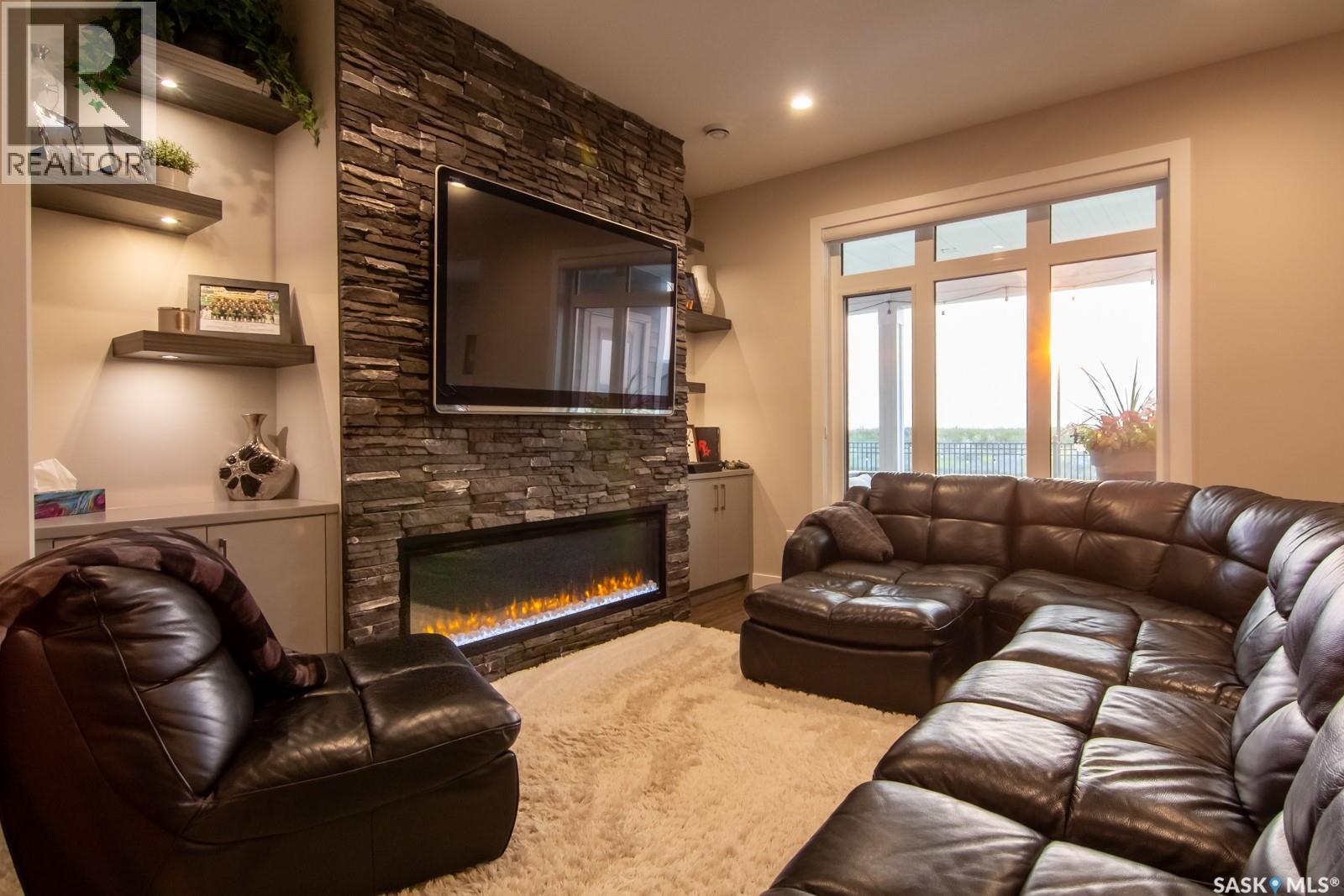 635 Kenaschuk Crescent, Saskatoon, SK - Indoor Photo Showing Living Room With Fireplace
