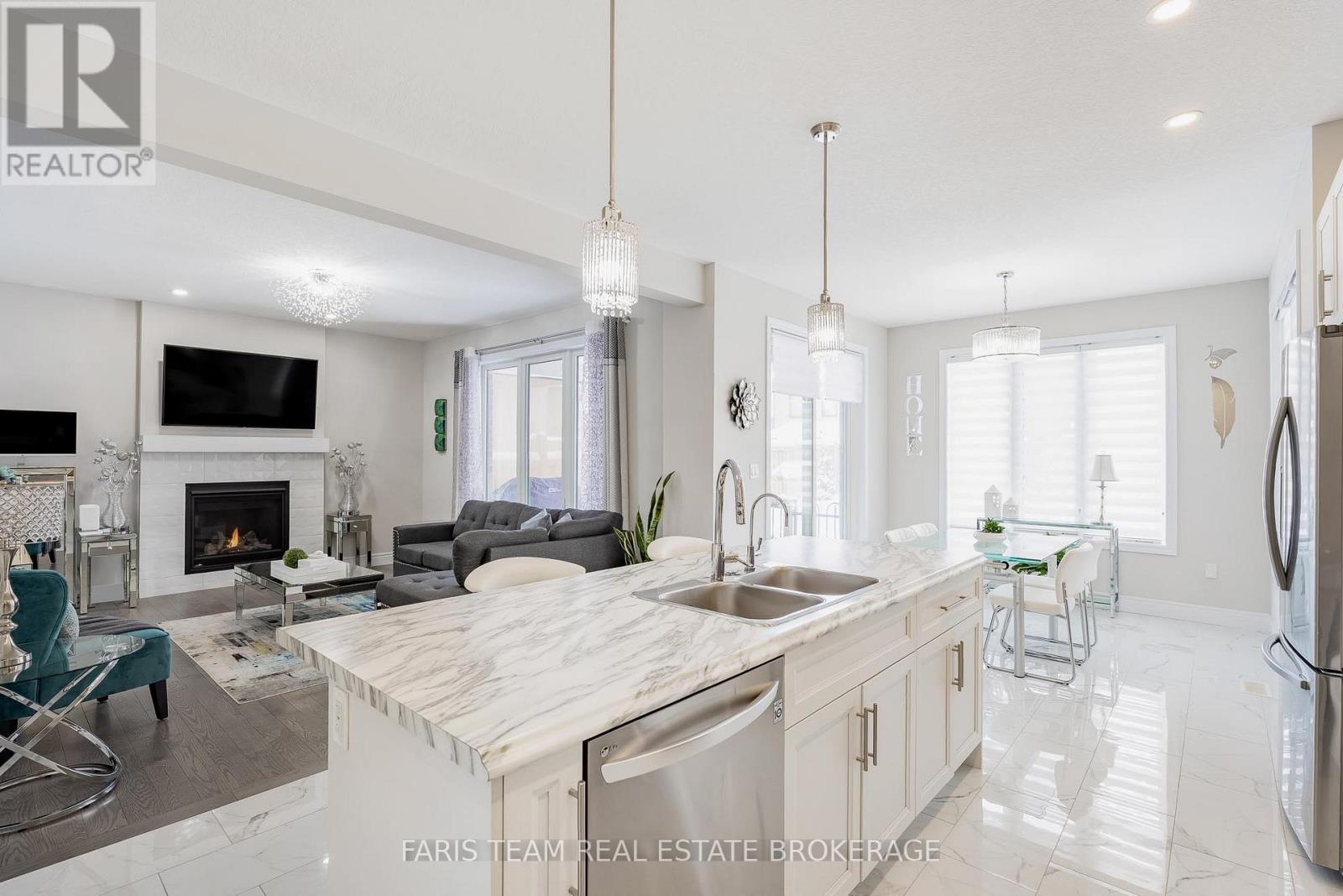 13 Tindall Crescent, East Luther Grand Valley, ON - Indoor Photo Showing Kitchen With Fireplace With Double Sink With Upgraded Kitchen