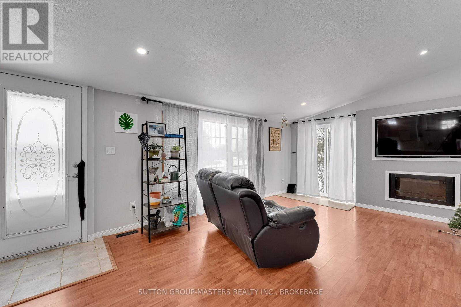 1677 County 2 Road, Front Of Yonge, ON - Indoor Photo Showing Living Room With Fireplace