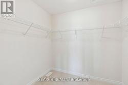 Walk -in closet in master bedroom -