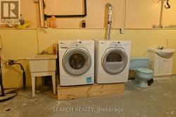 Laundry room with washroom & sink -