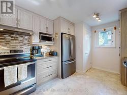 stainless steel appliances-side door entrance -