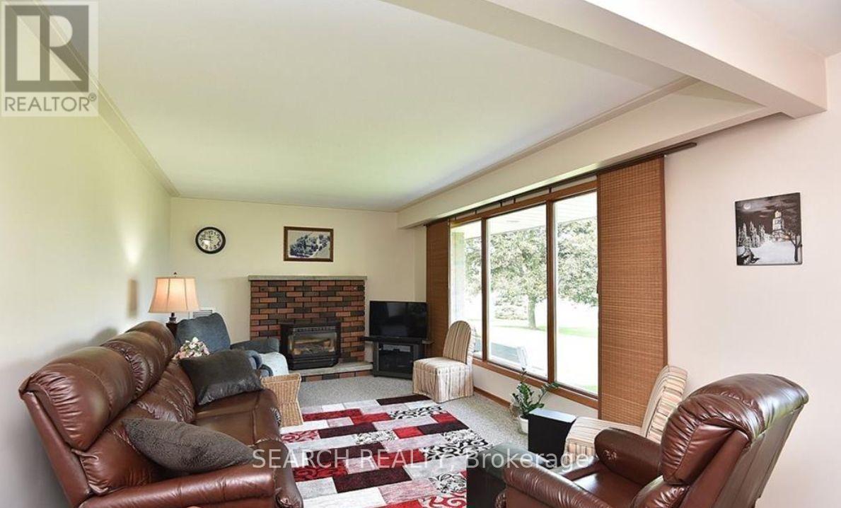5536 Hwy #3, Haldimand, ON - Indoor Photo Showing Living Room With Fireplace