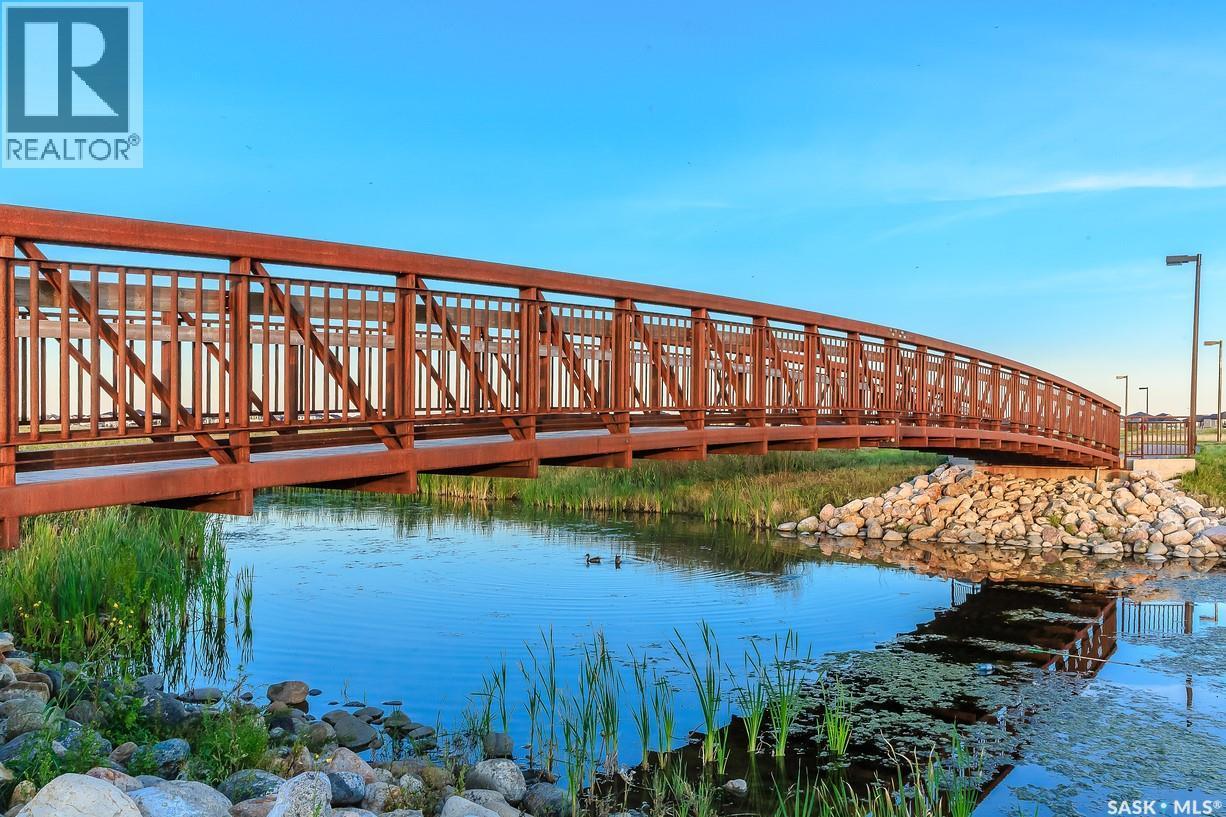 120 303 Slimmon Place, Saskatoon, SK - Outdoor With Body Of Water