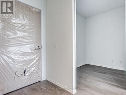 Front Door + Entrance to Fully Enclosed Den -