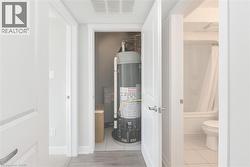 Utility room with gas water heater -