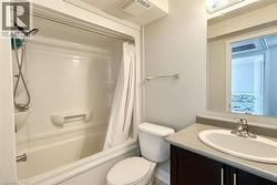 Bathroom with vanity and shower / bath combo -