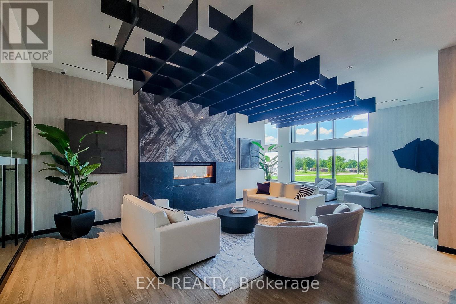 403 - 8020 Derry Road, Milton, ON - Indoor Photo Showing Living Room With Fireplace