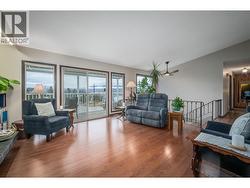 Living room with access to the front covered front deck! Nice and bright! -