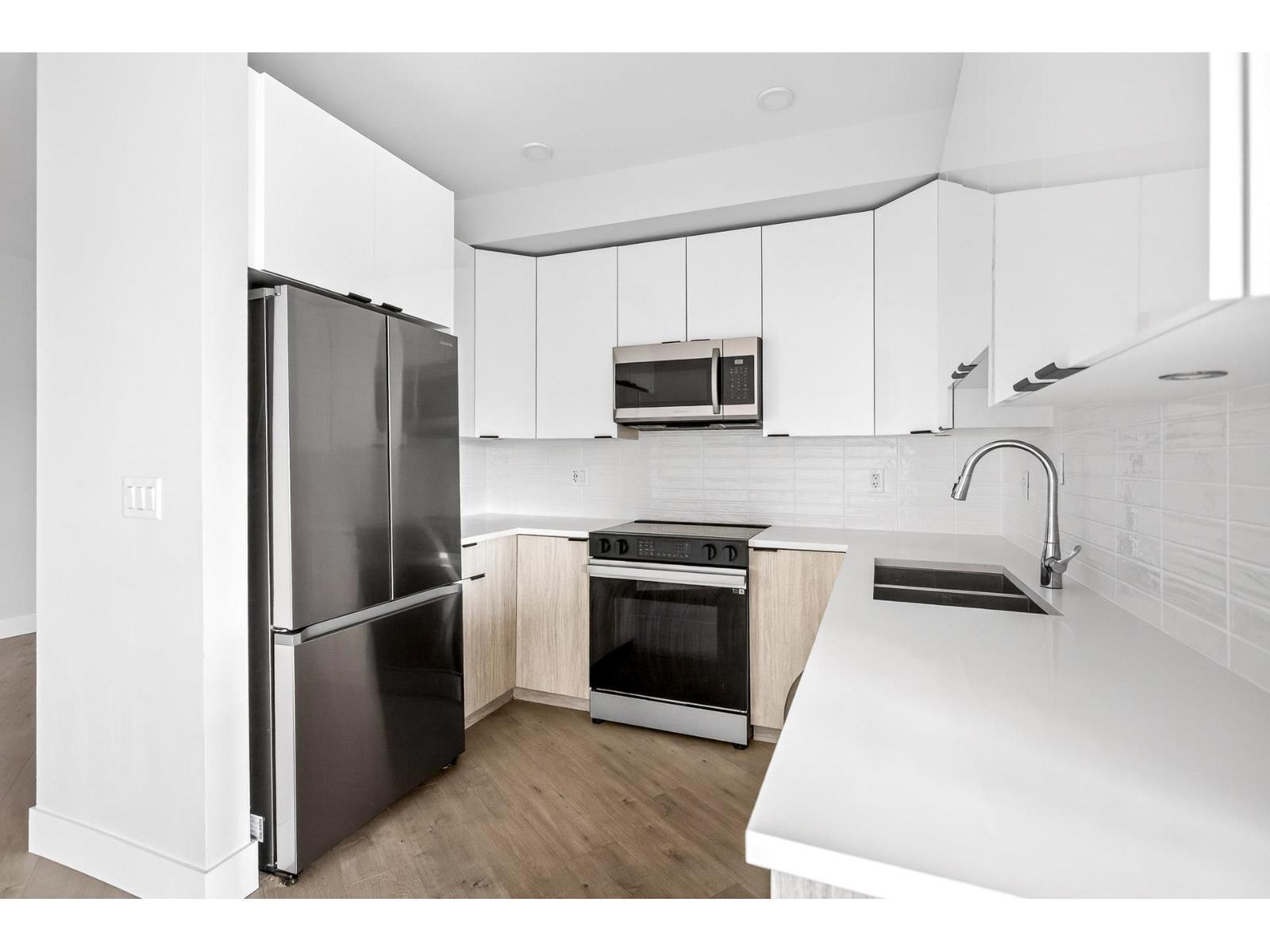 214 20061 Fraser Highway, Langley, BC - Indoor Photo Showing Kitchen With Stainless Steel Kitchen With Double Sink