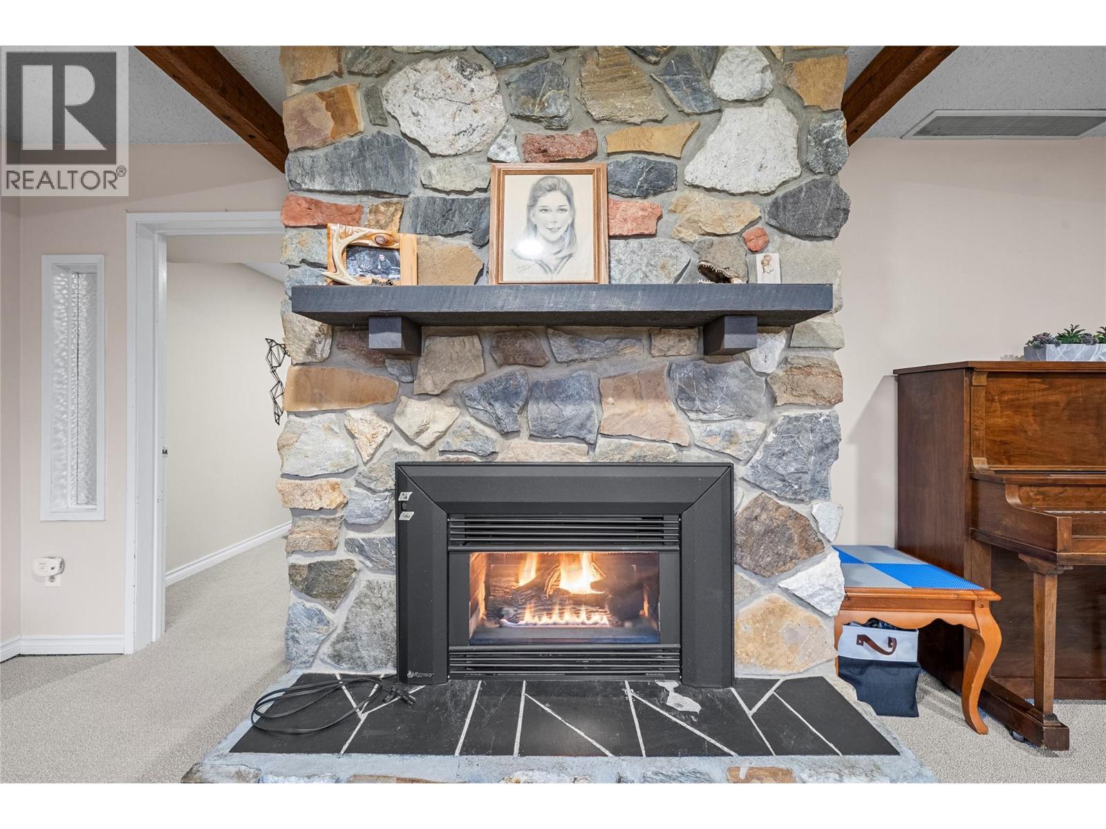 2150 1 Avenue Ne, Salmon Arm, BC - Indoor Photo Showing Other Room With Fireplace