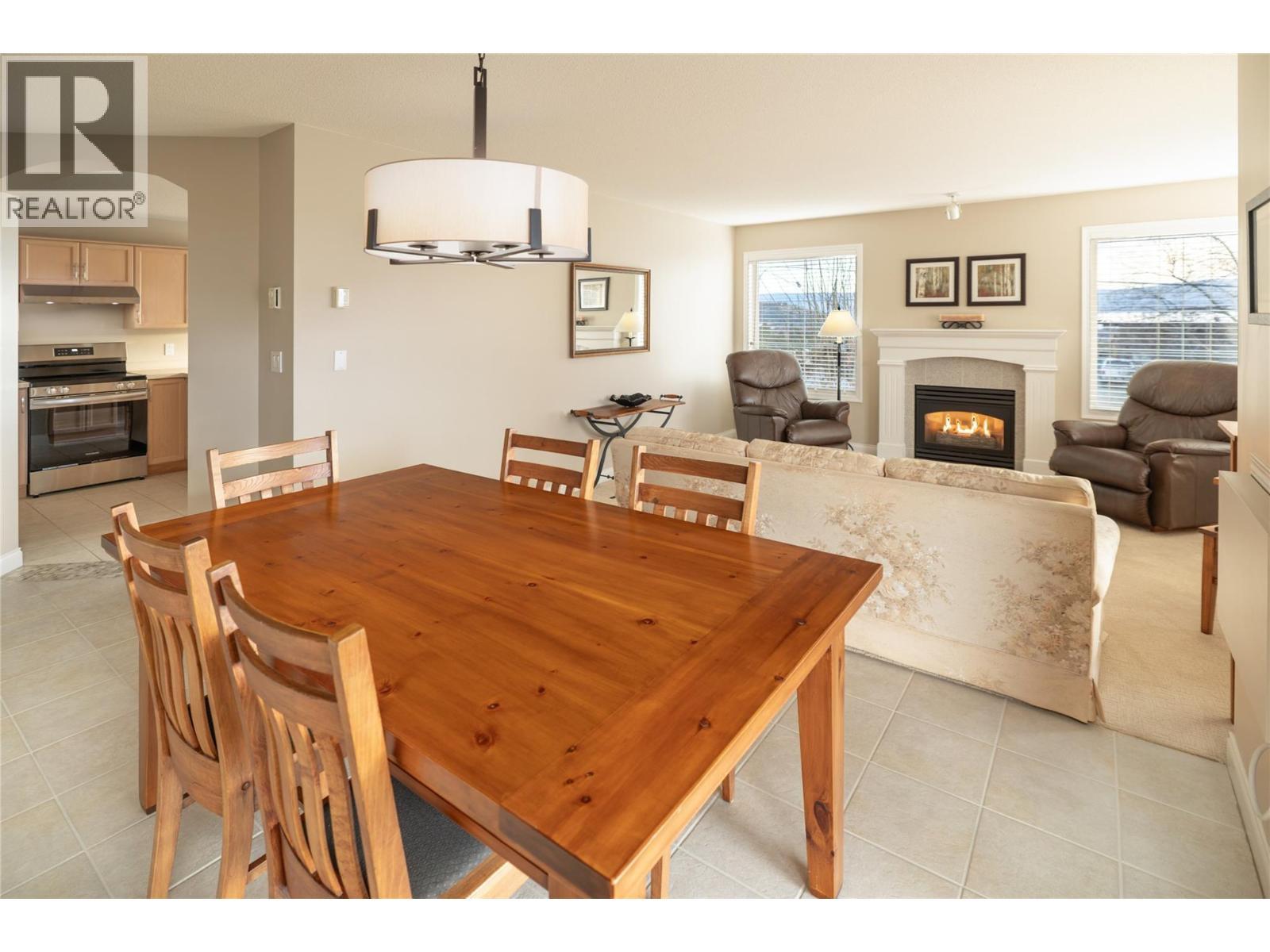 3870 Brown Road Unit# 211, West Kelowna, BC - Indoor Photo Showing Dining Room With Fireplace