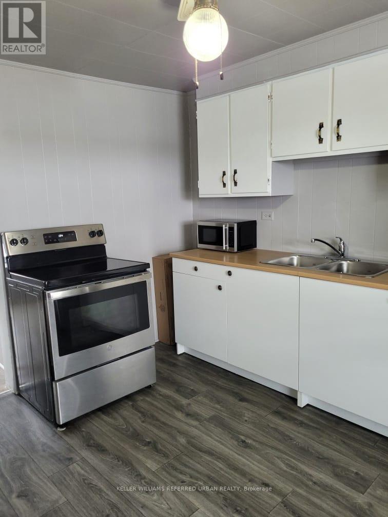 1004 Brock Road, Frontenac, ON - Indoor Photo Showing Kitchen With Double Sink