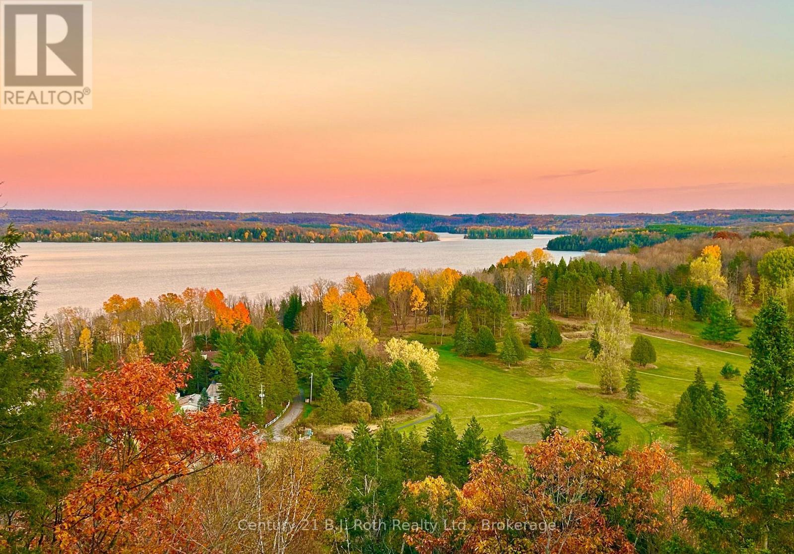 302 - 11 Treetops Lane, Huntsville (Chaffey), ON - Outdoor With Body Of Water With View