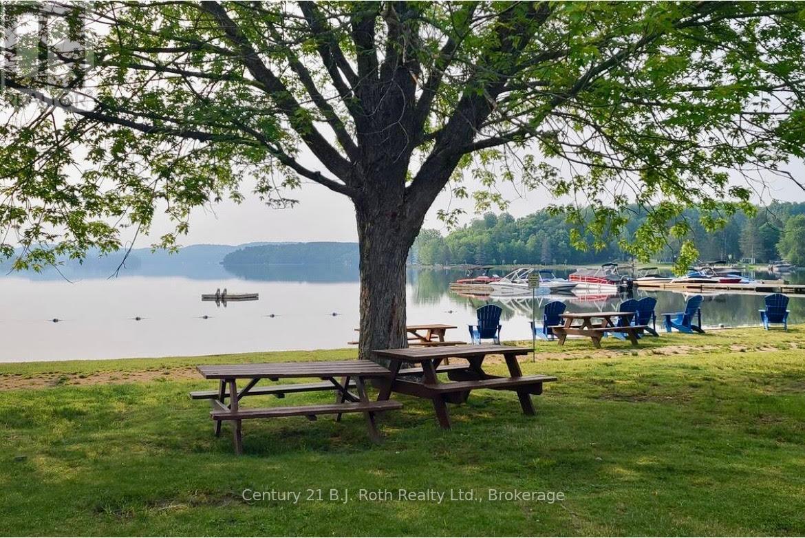 302 - 11 Treetops Lane, Huntsville (Chaffey), ON - Outdoor With Body Of Water With View