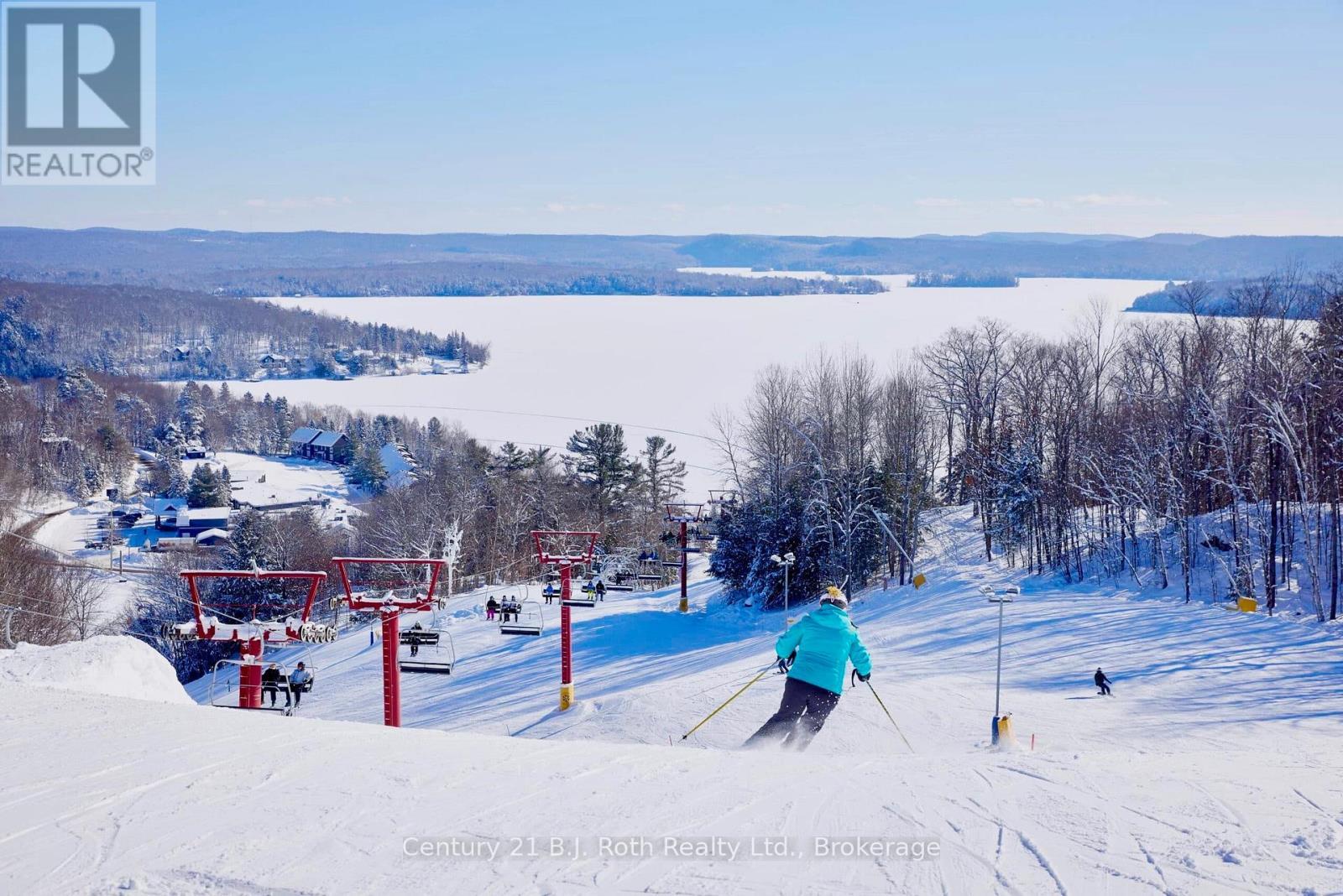 302 - 11 Treetops Lane, Huntsville (Chaffey), ON - Outdoor With Body Of Water With View
