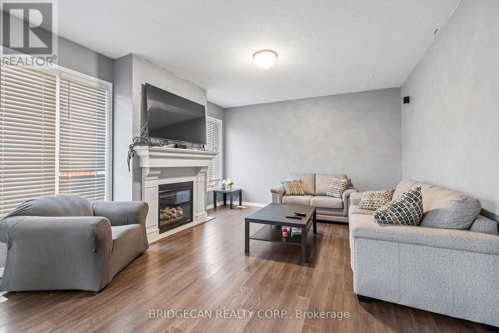 20 Gillespie Drive, Brantford, ON - Indoor Photo Showing Living Room With Fireplace