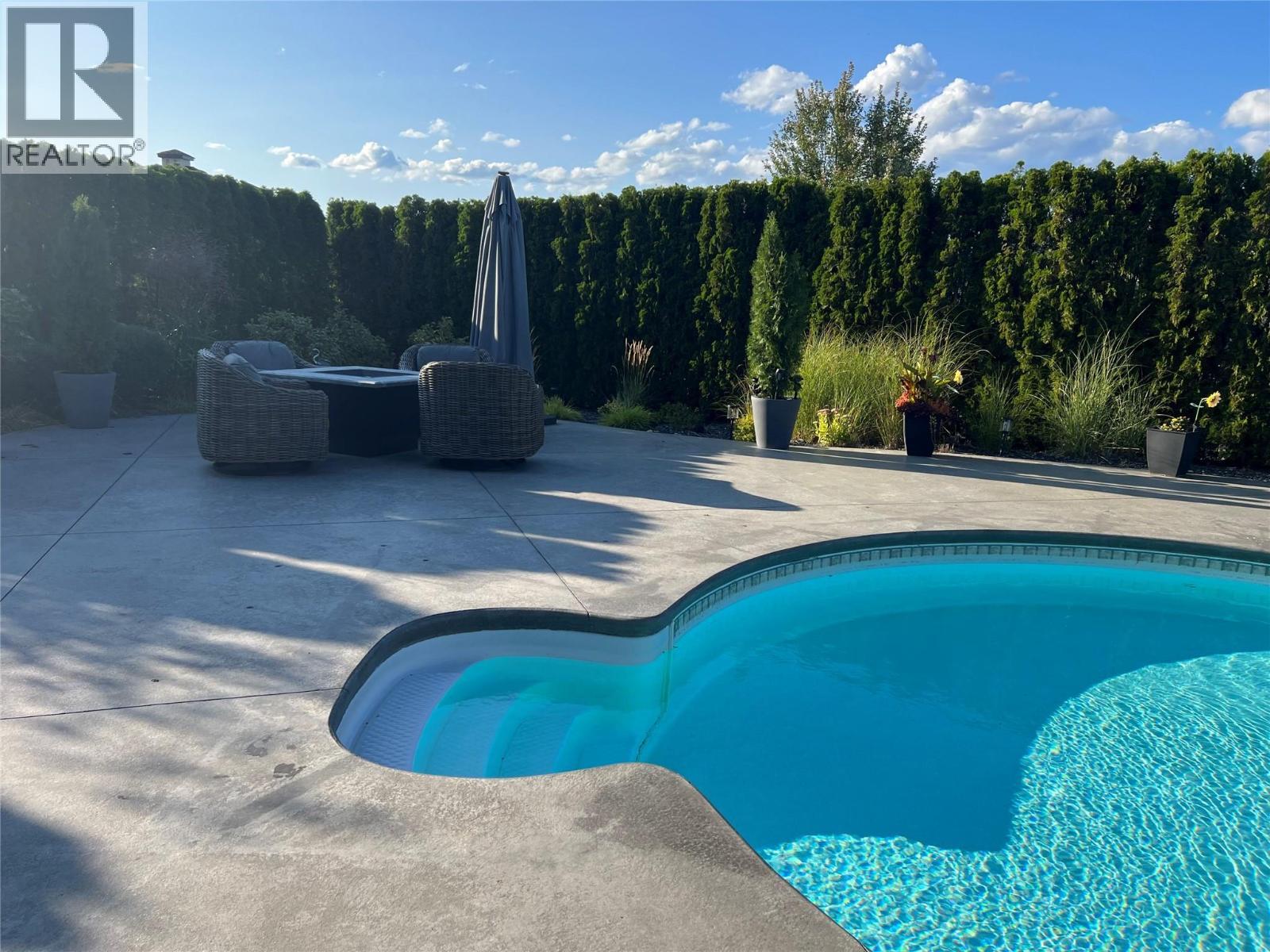 440 Audubon Court, Kelowna, BC - Outdoor With In Ground Pool