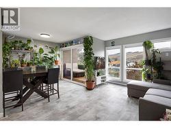 open living room and dining area with a sliding door to your deck -