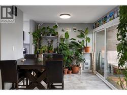 dining area, kitchen to the left, deck to the right -