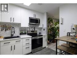 nicely updated kitchen, subway tile, vinyl floor -