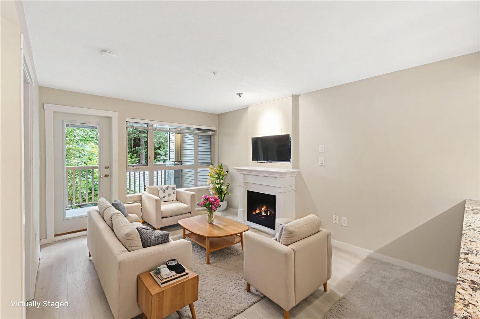 202-5670 Edgewater Lane, Nanaimo, BC - Indoor Photo Showing Living Room With Fireplace